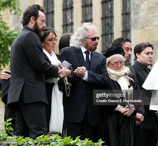 Barry Gibb , Robin's widow Dwina Murphy Gibb and Robin's son Robin-John Gibb attend the funeral of Robin Gibb held at St. Mary's Church, Thame on...