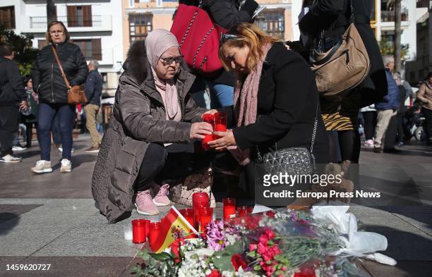 Neighbors place candles and flowers as tokens of grief in the Plaza Alta, Algeciras, where the lifeless body of a sacristan fell after the attack in...