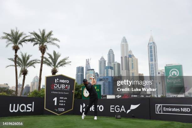 Tommy Fleetwood of England tees off on the 1st hole during Day One of the Hero Dubai Desert Classic at Emirates Golf Club on January 26, 2023 in...