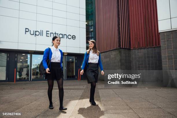 best friends in high school - building entrance stock pictures, royalty-free photos & images