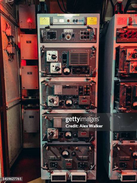 radio communications equipment in tall racks - military communications stock pictures, royalty-free photos & images