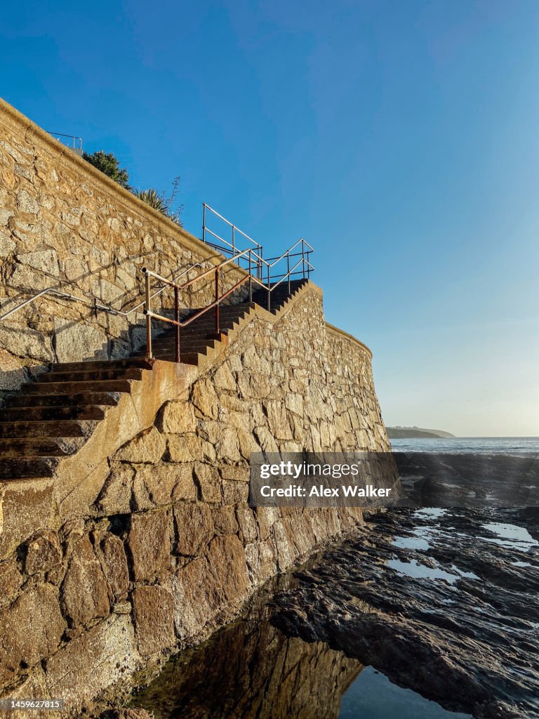 Ocean With Railing Staircase With Metal Railings Leading To Ocean High-Res Stock Photo ...