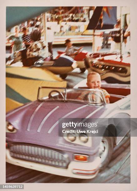 little boy on fairground - 1960s baby stockfoto's en -beelden