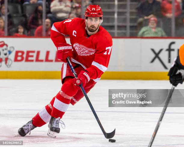 Dylan Larkin of the Detroit Red Wings skates up ice with the puck against the Philadelphia Flyers during the third period of an NHL game at Little...