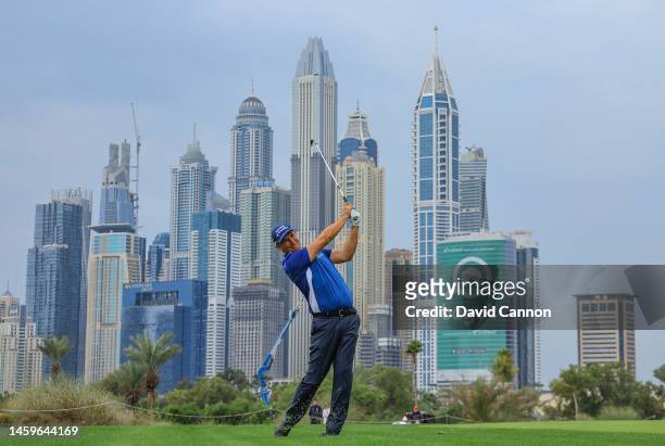 Padraig Harrington of Ireland plays his second shot on the 13th hole during Day One of the Hero Dubai Desert Classic on the Majlis Course at The...