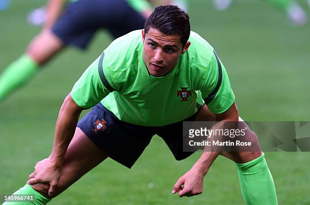 Cristiano Ronaldo stretches during a Portugal training session ahead of UEFA Euro 2012 at Arena Lviv on June 8, 2012 in L'viv, Ukraine.
