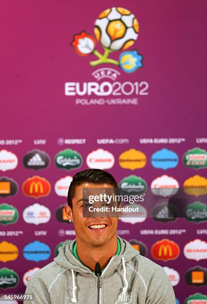 In this handout image provided by UEFA, Cristiano Ronaldo of Portugal talks to the media during a UEFA EURO 2012 press conference at the Arena Lviv...