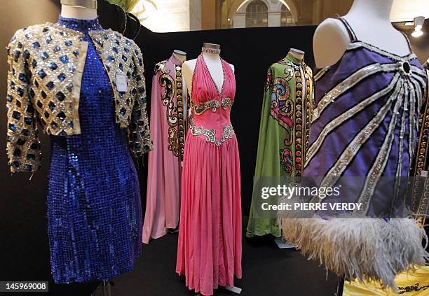 Costumes from the Folies Bergere are displayed at the Palais de la Bourse as part of the "Ventes de folie" auction in Paris on June 8, 2012. The...