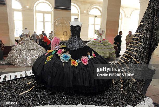 Costumes from the Folies Bergere are displayed at the Palais de la Bourse as part of the "Ventes de folie" auction in Paris on June 8, 2012. The...