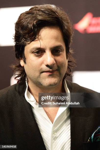 Indian actor Fardeen Khan pose on the green carpet during the IIFA Rocks Green Carpet on day two of the 2012 International India Film Academy Award...