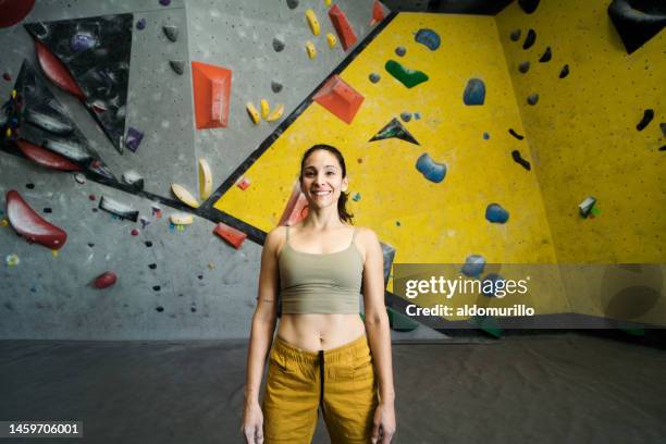 happy female climber smiling at camera - medium shot stock pictures, royalty-free photos & images