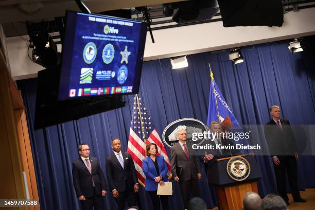 Director of the Federal Bureau of Investigation Christopher Wray , joined by Attorney General Merrick Garland , Assistant Attorney General Lisa...