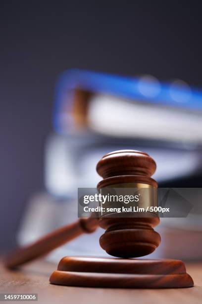 close-up of gavel and stacks of files,documents on table,malaysia - tax penalty stock pictures, royalty-free photos & images