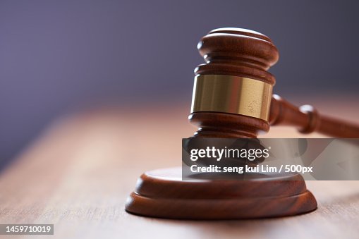 Selective focus on gavel hammer on wooden table top with copy space,Malaysia