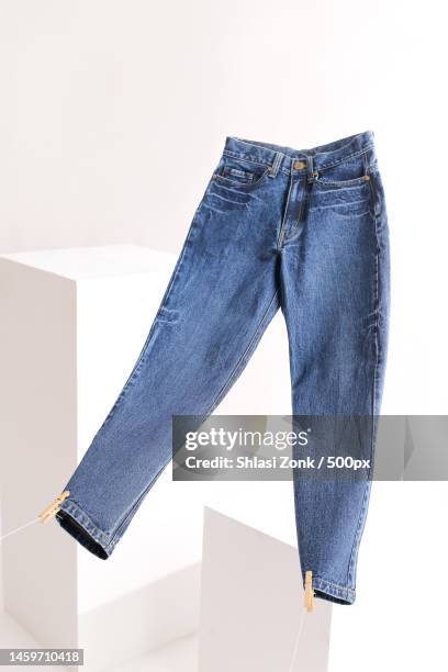 high angle view of jeans on white background,indonesia - jeans fotografías e imágenes de stock