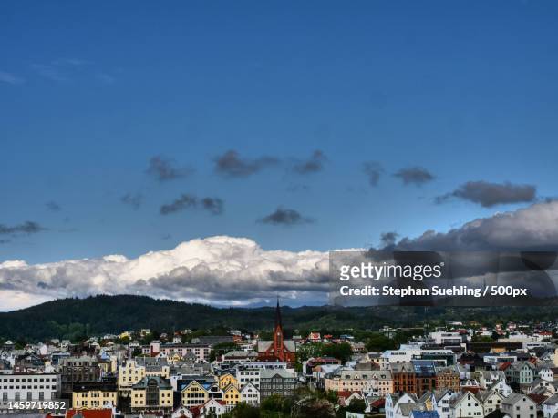 high angle shot of townscape against sky,haugesund,norway - haugesund stockfoto's en -beelden