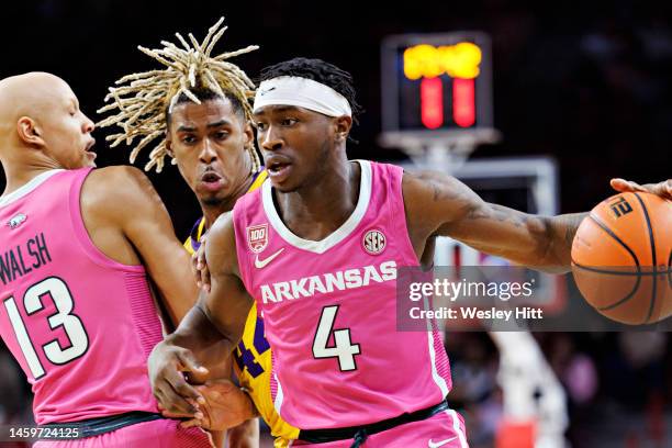 Davonte Davis of the Arkansas Razorbacks drives to the basket during a game against the LSU Tigers at Bud Walton Arena on January 24, 2023 in...