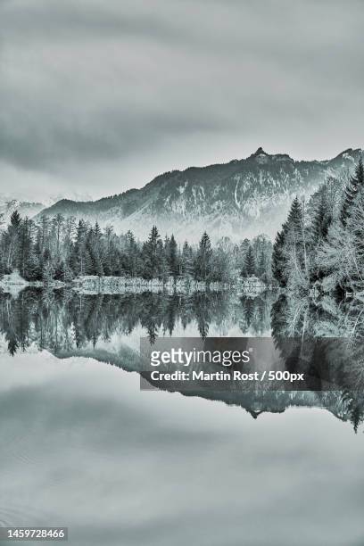 scenic view of lake by mountains against sky,murnauer moos,germany - murnau stock pictures, royalty-free photos & images