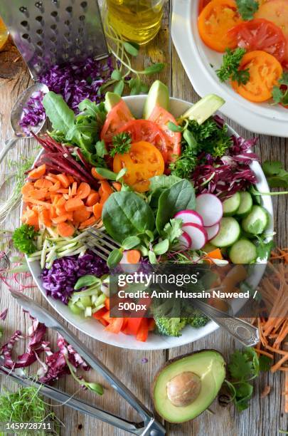 high angle view of salad in bowl on table - salladsskål bildbanksfoton och bilder