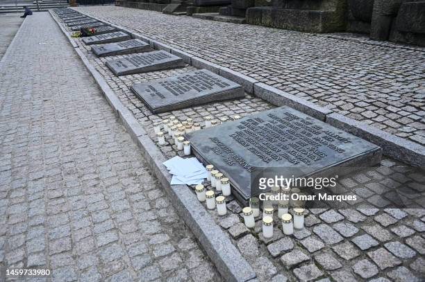 Candles and letters lay by a memorial stone at the International monument for the victims of fascism inside the former Nazi death camp Auschwitz...
