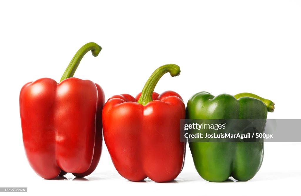 Close-up of bell peppers against white background,Spain