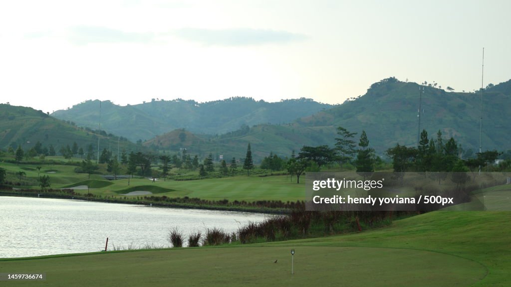 Scenic view of lake and mountains against sky,Bandung,Indonesia