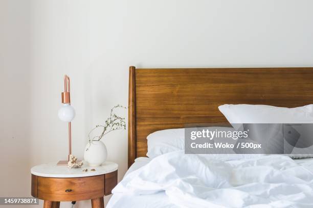 empty bed at home,indonesia - wooden headboard bildbanksfoton och bilder