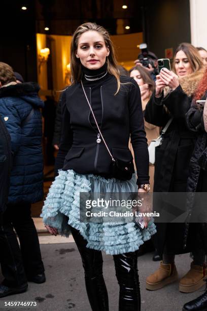Olivia Palermo wears a black jacket, light blue tulle skirt, black vinyl leggings and black boots, outside Viktor & Rolf, during Paris Fashion Week -...