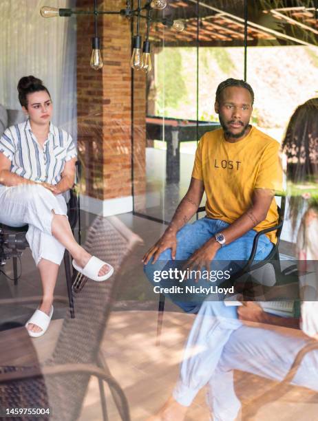 young man speaking during a group therapy session with a counselor - inner courage stock pictures, royalty-free photos & images