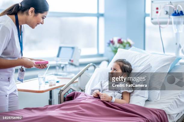popsicle after surgery - nurse maroon stock pictures, royalty-free photos & images
