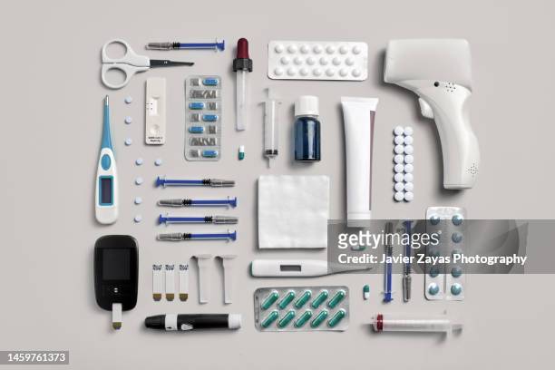 medical supplies on pastel colored background - medical instrument stock pictures, royalty-free photos & images