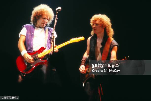 Paul Warren Dean and Jim Clench of the band Loverboy in concert at The Spectrum November 18, 1983 in Philadelphia, Pennsylvania