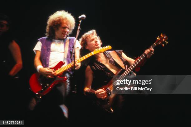 Paul Warren Dean and Jim Clench of the band Loverboy in concert at The Spectrum November 18, 1983 in Philadelphia, Pennsylvania