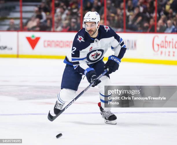 Dylan DeMelo of the Winnipeg Jets skates against the Ottawa Senators during the game at Canadian Tire Centre on January 21, 2023 in Ottawa, Ontario,...