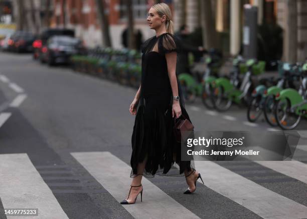 Marina von Lison seen wearing black Gemy Maalouf dress, black Christian Louboutin heels, small brown Thalie Paris bag, Jaubalet jewellery before Elie...