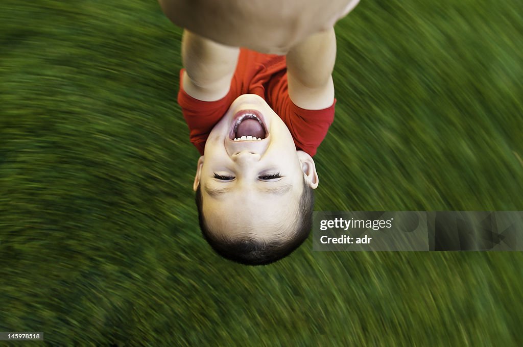 Summer fun child spinning in circles