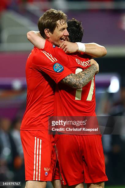 Roman Pavlyuchenko of Russia celebrates scoring their fourth goal with Alan Dzagoev during the UEFA EURO 2012 group A match between Russia and Czech...