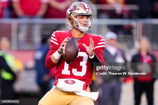 Brock Purdy of the San Francisco 49ers looks to pass against the Dallas Cowboys during the first quarter in the NFC Divisional Playoff game at Levi's...