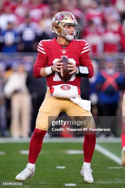 Brock Purdy of the San Francisco 49ers looks to pass against the Dallas Cowboys during the first quarter in the NFC Divisional Playoff game at Levi's...