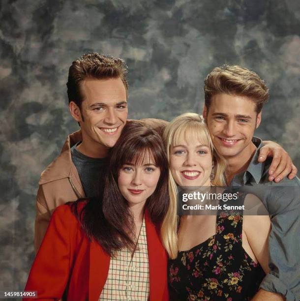Actors Luke Perry, Shannen Doherty, and Jason Priestley pose for a portrait on the set of Beverly Hills, 90210 September 1991 in Los Angeles,...