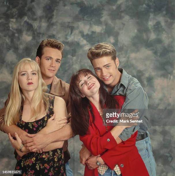 Actors Luke Perry, Shannen Doherty, and Jason Priestley pose for a portrait on the set of Beverly Hills, 90210 September 1991 in Los Angeles,...