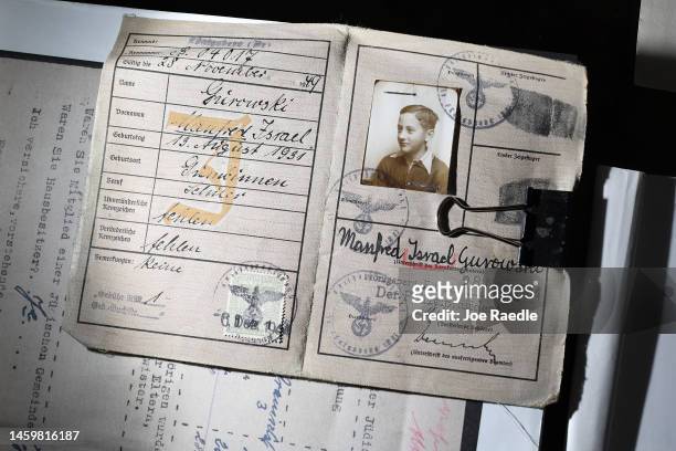 Manny Gurowski, a child survivor of the Holocaust, continues to hold onto the Jewish Identification card the Nazis gave to him in 1944 on January 26,...