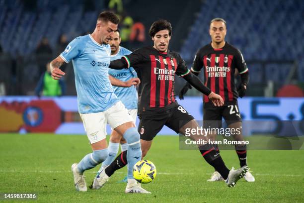 Sergej Milinković-Savić of SS Lazio and Sandro Tonali of AC Milan compete for the ball during the Serie A match between SS Lazio and AC MIlan at...