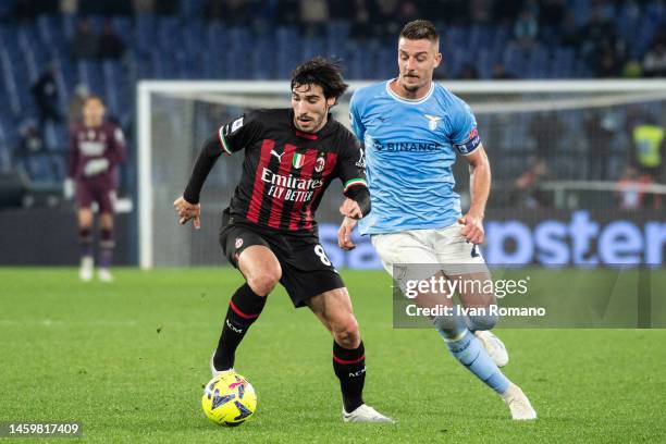 Sergej Milinković-Savić of SS Lazio and Sandro Tonali of AC Milan compete for the ball during the Serie A match between SS Lazio and AC MIlan at...