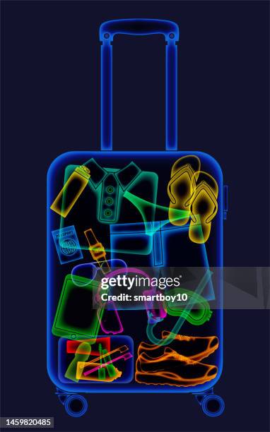 röntgenaufnahme eines urlaubskoffers eines mannes - airport x ray images stock-grafiken, -clipart, -cartoons und -symbole