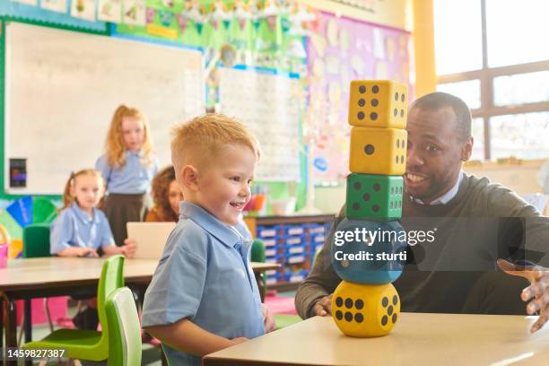 number play in the classroom - t shirt uniform stock pictures, royalty-free photos & images