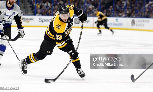 Charlie Coyle of the Boston Bruins shoots during a game against the Tampa Bay Lightning at Amalie Arena on January 26, 2023 in Tampa, Florida.