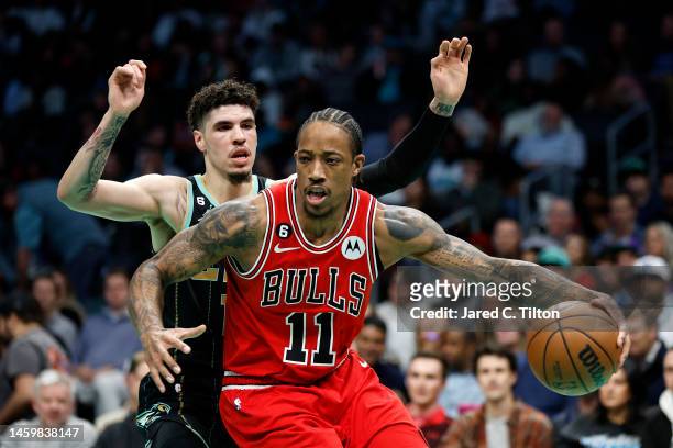 DeMar DeRozan of the Chicago Bulls drives to the basket against LaMelo Ball of the Charlotte Hornets during the second quarter of the game at...
