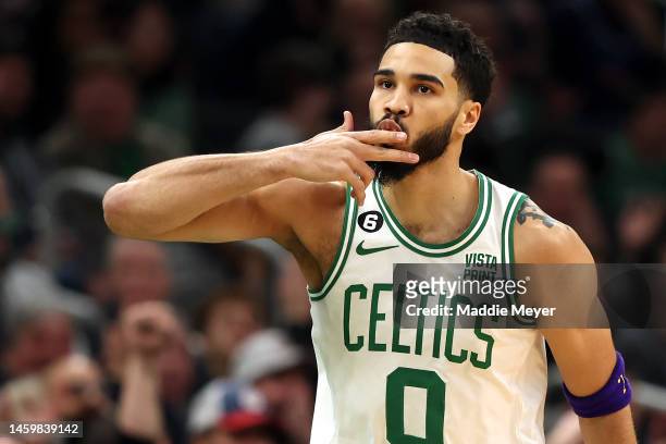 Jayson Tatum of the Boston Celtics celebrates after hitting a three point shot against the New York Knicks during the first half at TD Garden on...