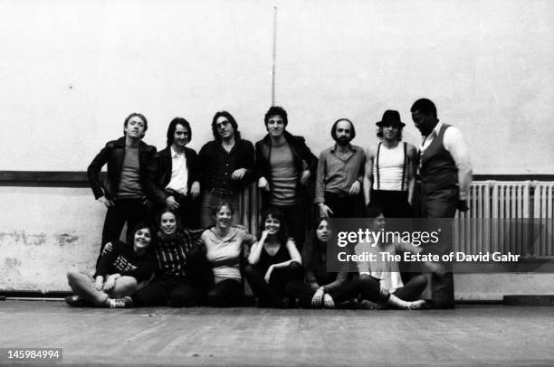 Bruce Springsteen and the E Street Band pose for a portrait with fans of the group on October 17, 1979 in Red Bank, New Jersey.